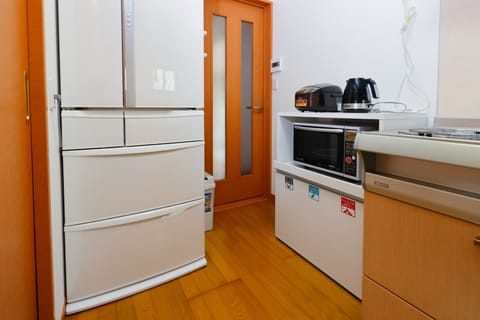 Fridge, microwave, cookware/dishes/utensils