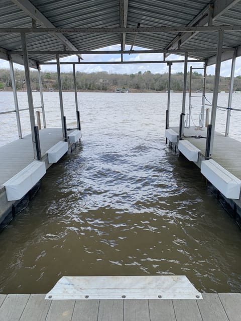 Slip width is 9' from inside to inside of the white bumpers.