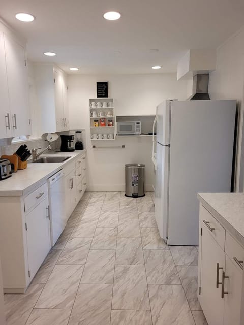 Galley kitchen, well appointed with ample dishes, silverware and cookware.