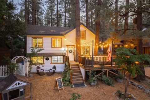 Charming cabin retreat nestled among the pines. Perfect for a peaceful getaway with twinkle lights, warm vibes, and forest magic.