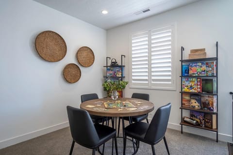 Upstairs living room game nook with a game table and many games provided!