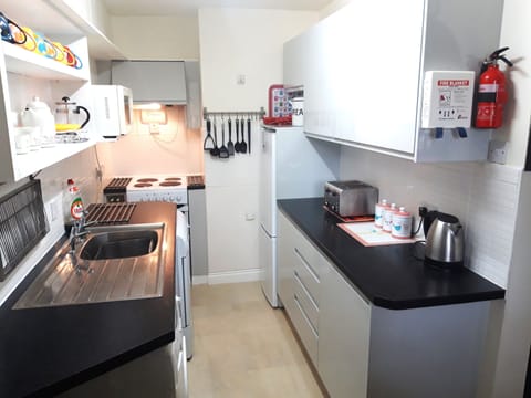 The clean line galley kitchen has plenty of storage for all your cooking needs!