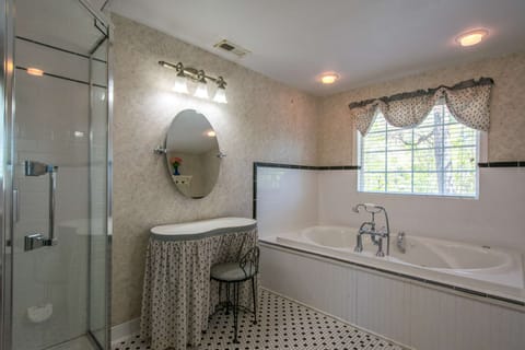 Large bathroom with jetted tub.