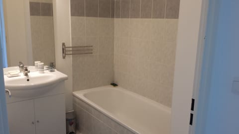 Combined shower/tub, hair dryer, soap, toilet paper