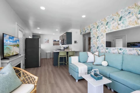 Open layout shows kitchen and living area