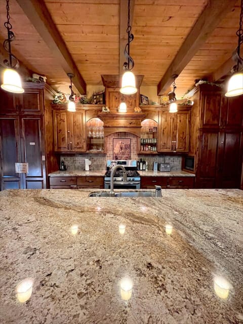 Marble countertops, a stainless steel gas stove and oven, microwave, electric wine opener, and more!