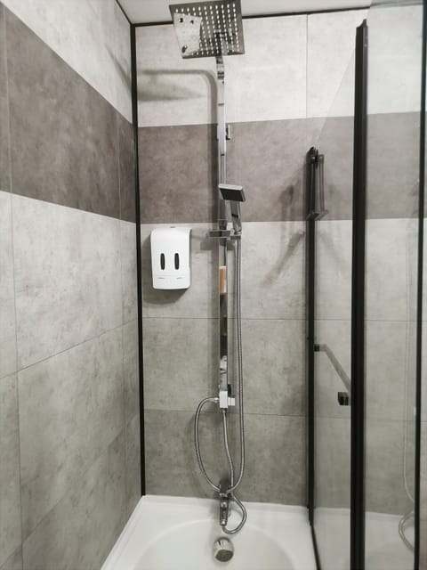 Combined shower/tub, hair dryer, towels, soap