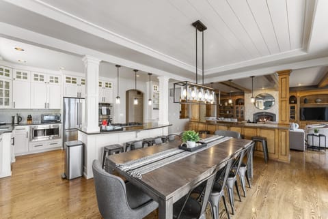 Chef's kitchen with double ovens, Dining table seats 12, 4 stools at each island