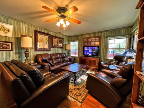 Livingroom area with plenty seating and Texas memorabilia abound  