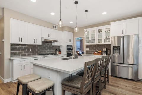 Fully renovated kitchen with stainless steel appliances, oversized island..