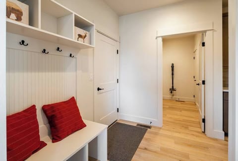 Mud room, access to garage, laundry room.