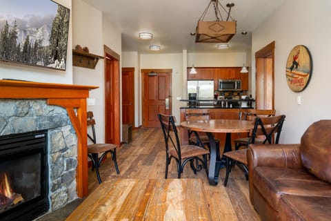 A warm and inviting living room with a gas fireplace, cable TV, and a sleeper sofa, perfect for relaxing or accommodating extra guests