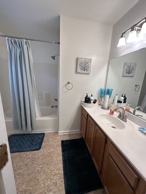 Combined shower/tub, hair dryer, towels, soap