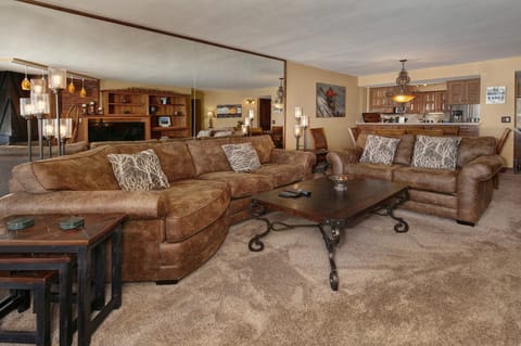 Living area with smart TV and gas fireplace.