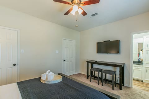 Queen Bed with TV and large closet and master bathroom