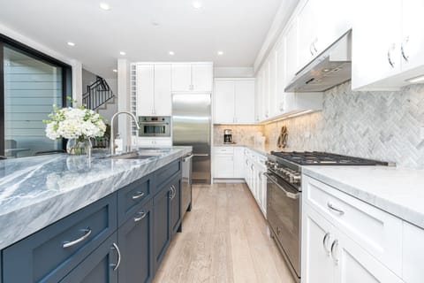 The kitchen is outfitted with premium stainless steel appliances and all the necessary cook and bakeware. Guests provide their own food and condiments.