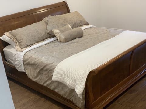 King comfortable bed in spacious master bedroom