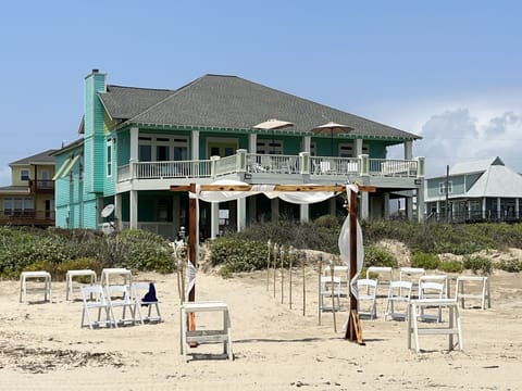 Wedding ceremony set up in front of the house.
