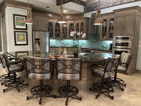 Fully equipped kitchen and dining area with plenty of seating.