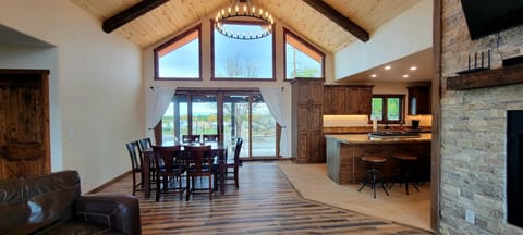 Table for 8 right off the kitchen. Large glass patio doors for sunset views.