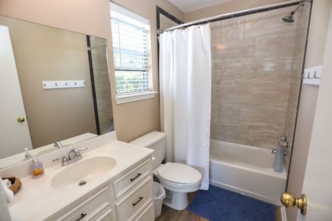 Combined shower/tub, hair dryer, towels, soap