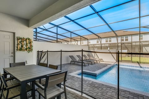 A heated pool, sun loungers