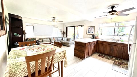 Dinning table with 3 chairs and two bar chairs to seat comfortably 5 people