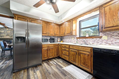 Both regular coffee and K cups provided, along with some creamers in the cabinet above. Our kitchen is fully stocked for your enjoyment with plenty of dishes, pots and pans, and platters to host!