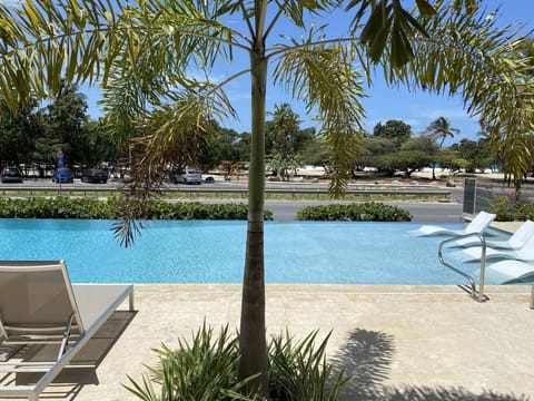 Outdoor pool, an infinity pool, sun loungers