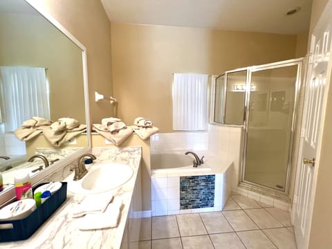 Combined shower/tub, hair dryer, towels, soap