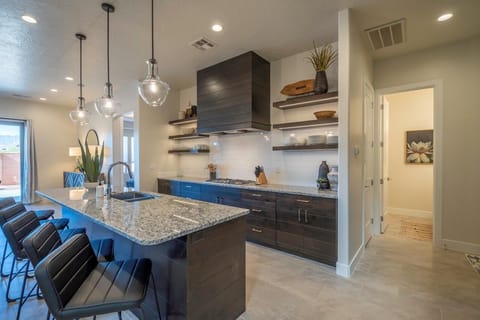 Kitchen is stocked with appliances and utensils for cooking