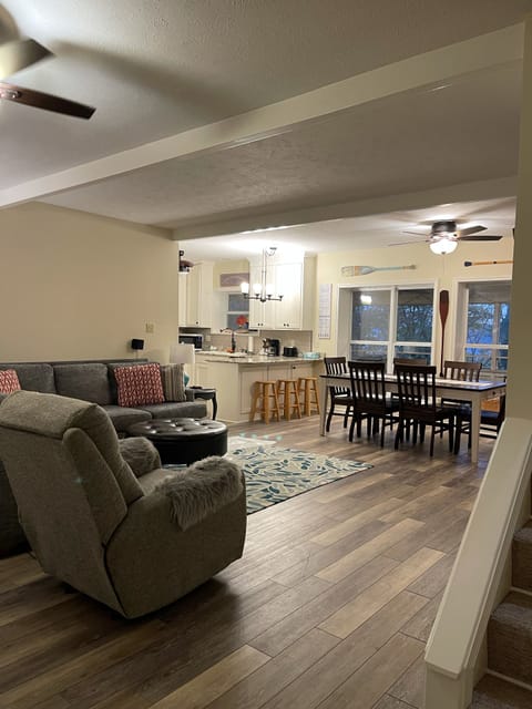 Living room view looking towards kitchen . Screened in porch adjoins. Lake view!