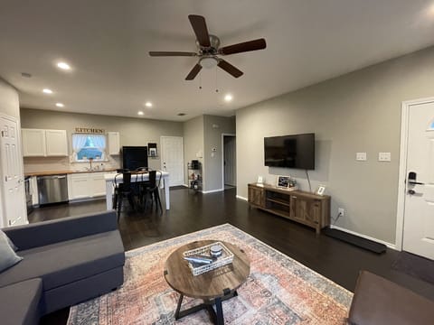 Living room is open to the kitchen so no one misses out!