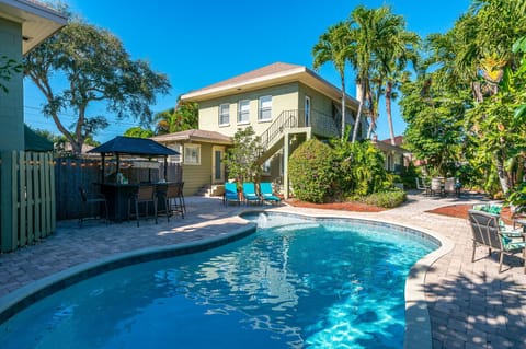 The Caribbean- style home has lush landscaping and beautiful saltwater pool.