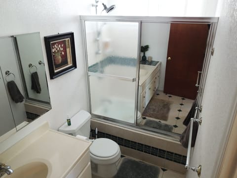 Combined shower/tub, hair dryer, towels, soap