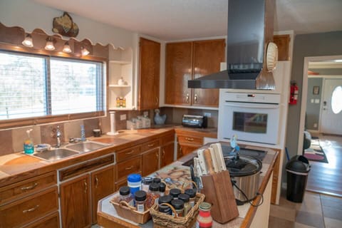Country Kitchen with double sink, crockpot, toaster oven, microwave. 