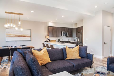 Open living space with view into kitchen and dining area