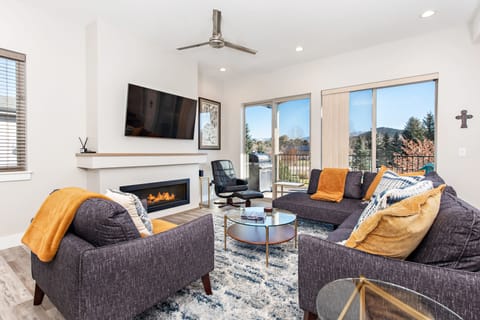 Living room with SmartTV and balcony access