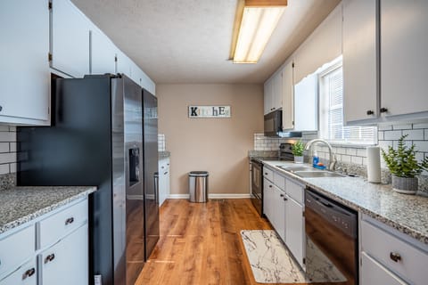 A spacious kitchen with plenty of storage space.