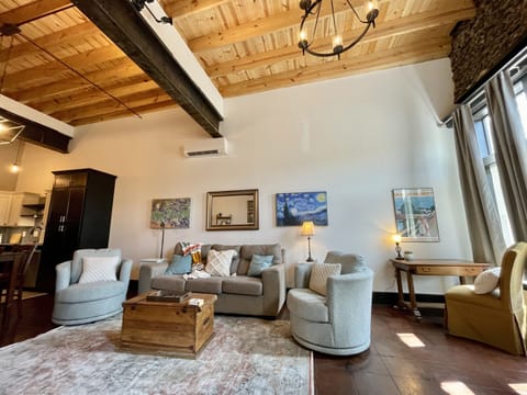 Living room with high ceilings and windows