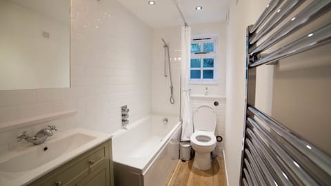 Combined shower/tub, hair dryer, towels, toilet paper