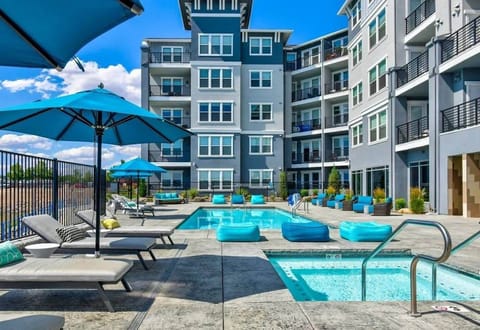 Shared heated pool and jacuzzi overlooking the waterfront.