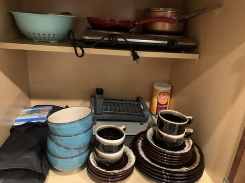 Fridge, microwave, coffee/tea maker, cookware/dishes/utensils