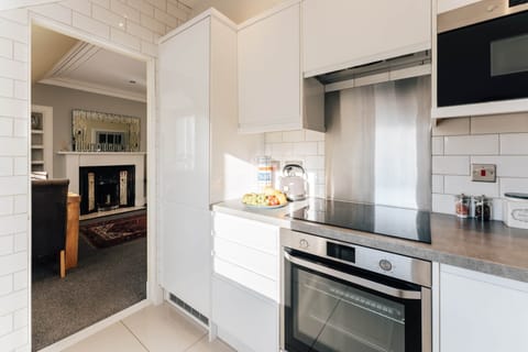 Bright open plan kitchen leading to living room