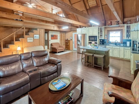 Open concept living room and fully stocked kitchen