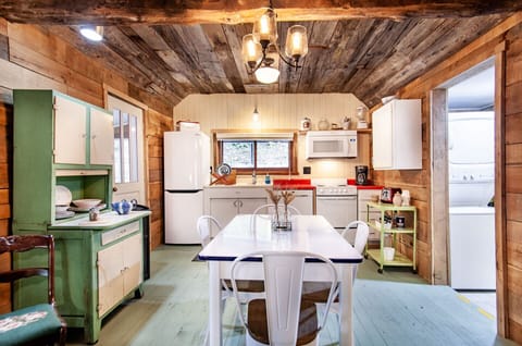 Warm wooden tones and charming barn-style details give this home a nostalgic feel, while the thoughtful layout ensures modern comfort.