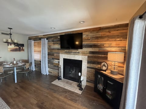 Cozy accent wall with Smart TV and fireplace 