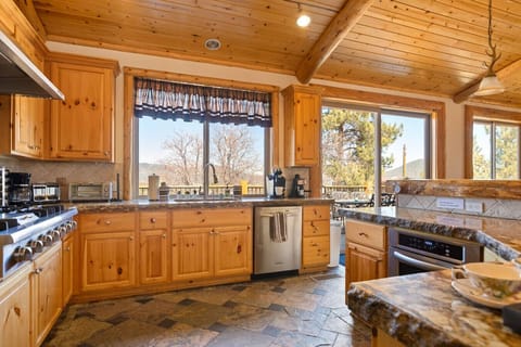 Large kitchen with views, fully stocked.