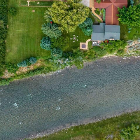 This home boasts front-row river views and direct access to Roaring Fork River.