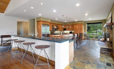 Plenty of storage, 2 sinks, Side-by-Side Refrigerator &10 bar stools for seating